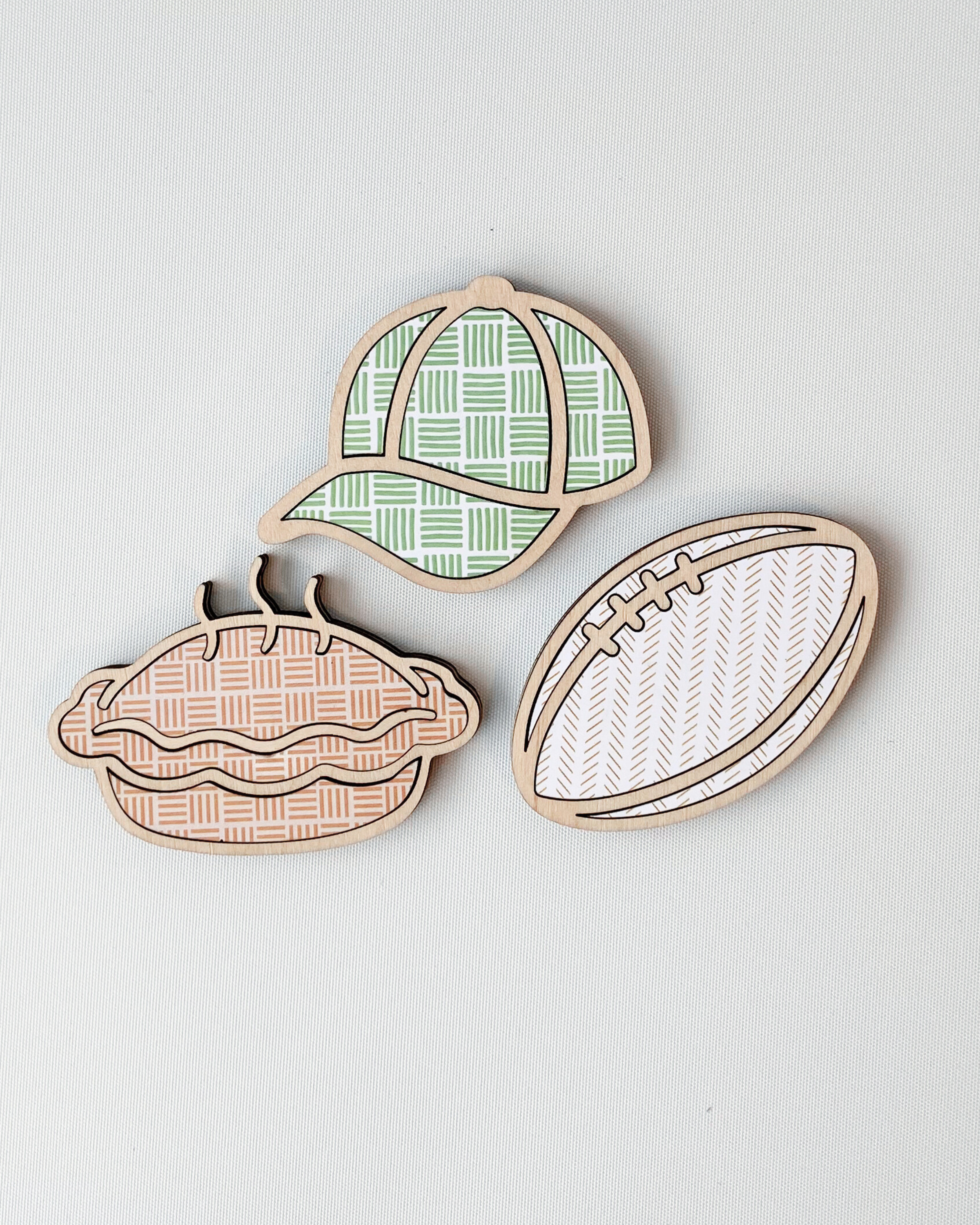 Dad Magnets set of three with Cap, Pie and Rugby Ball options, made out of laser-cut plywood.