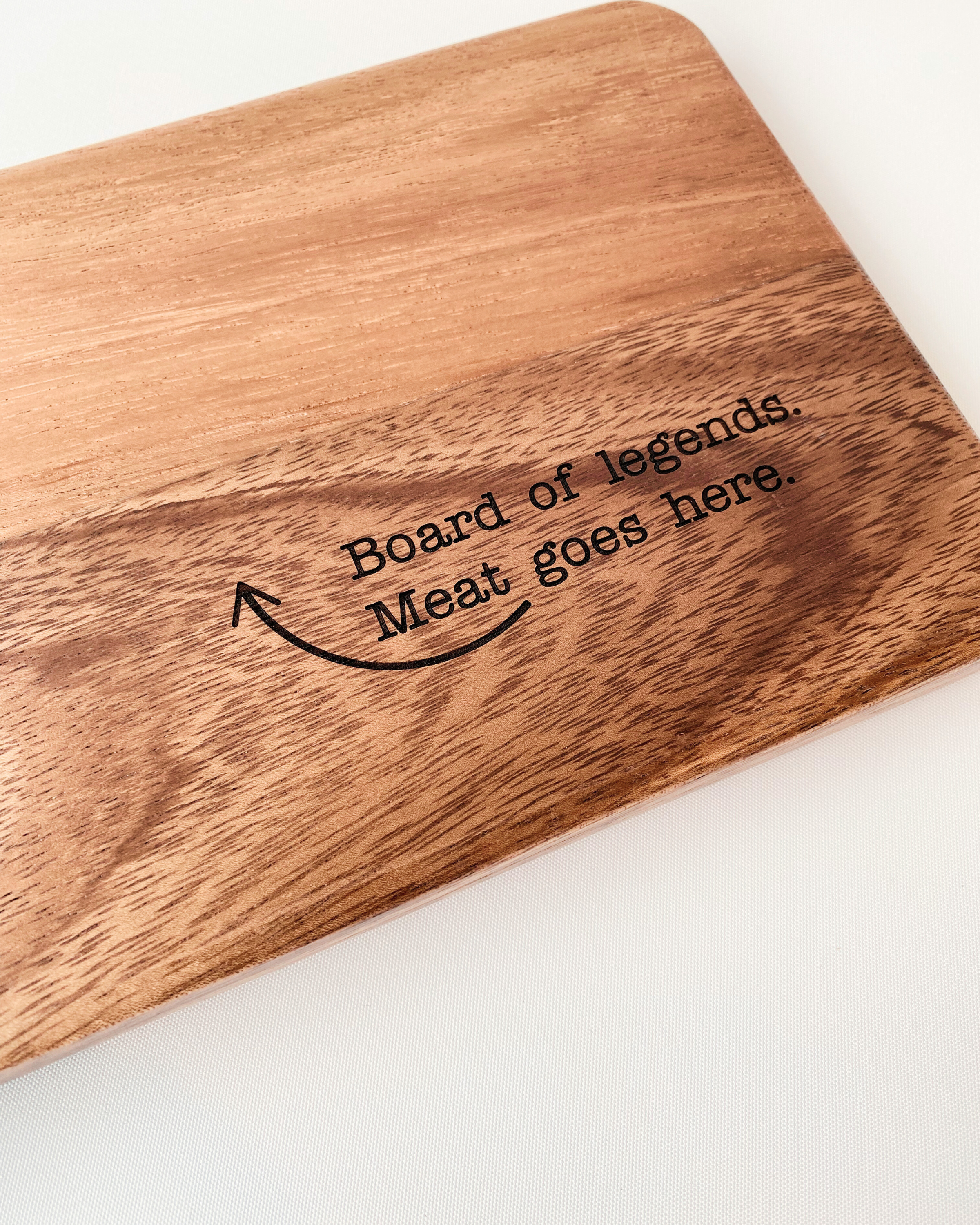 Dad Board chopping or serving board engraved with 'Board of Legends. Meat Goes Here." Made from food-grade acacia wood.