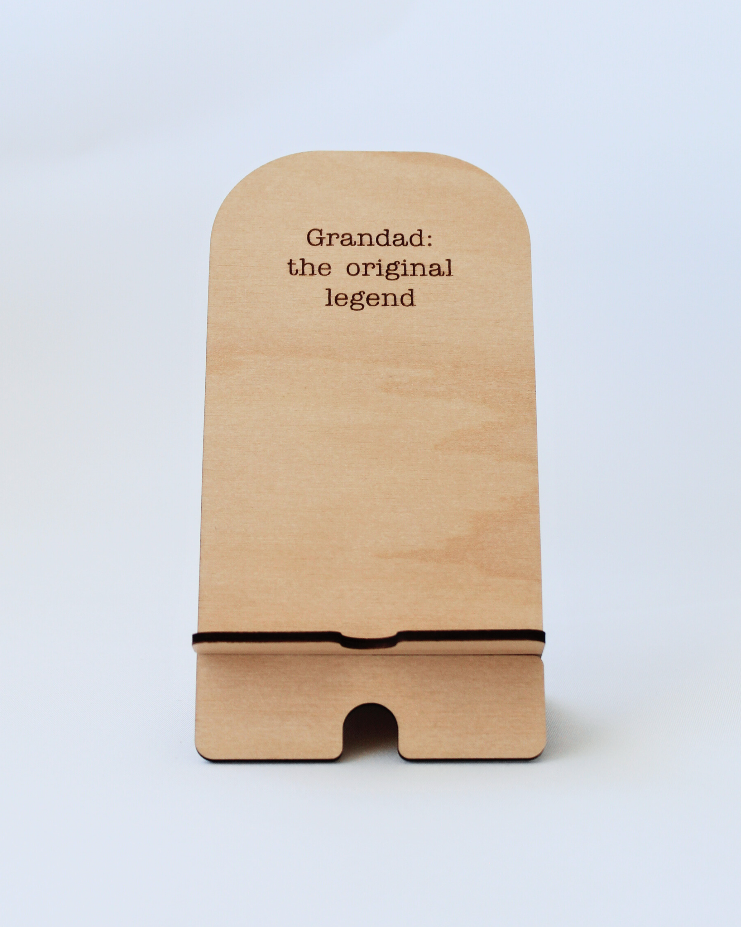 Wooden Phone Stand in the Original Legends design against a white background.